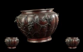 Japanese Antique Bronze Meiji Period Jardiniere with cast birds amongst flowers and branches, with a