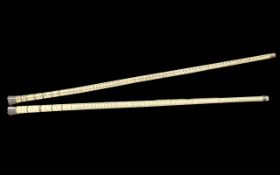 Pair of Oriental Vertibrae Batons of fine quality with horn handle and tips, circa 1900s. 20'' in