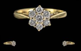 Ladies 18ct Gold Diamond Set Cluster Ring. Flowerhead setting, hallmark to interior of shank. Well-