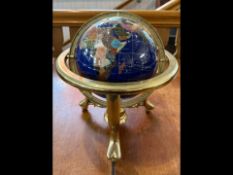 Gem Set Globe on brass swivel gimbel. Measures 8'' high.