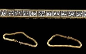Ladies Pleasing 18ct Gold Diamond Set Line Bracelet, marked 18ct 750. Well-matched Princess cut