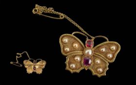 Antique Butterfly Brooch, the wings set with split pearls, and two faceted rubies to body. Unmarked,