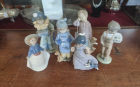 Six Nao Figures, to include a clown, sleepy boy with teddy, girl with dog, boy with football, plus