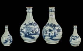 Pair of Early 18th Century Chinese Underglazed Blue Garlic Neck Vases, decorated with an extensive