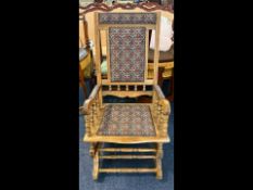 A Traditional American Style Antique Rocking Chair, with upholstered seat and back.