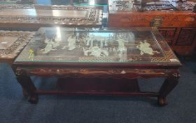 Chinese Low Table, finely lacquered with gilt decorations, the inserted glazed top decorated with
