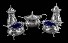 Silver Five Piece Cruet Set, salt and pepper pots, salt pots with blue liners and spoons, and