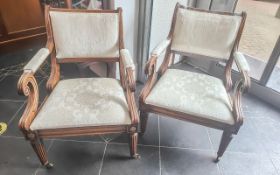 Pair of Mahogany Arm Chairs, with drop in seats and upholstered back and arm rests in cream.