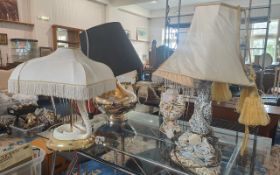 Four Modern Table Lamps, comprising a python base, a dragon base, cherub base and globular shape.
