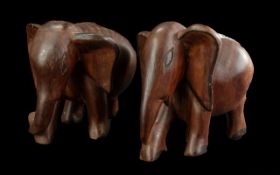 Pair of Carved Teak Oriental Elephants, measure 7'' high x 7'' wide.