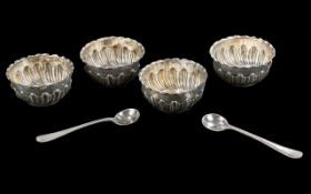 Cased Set of Embossed Silver Salt Cups (weight 79 grams), fitted in a case, with two salt spoons.