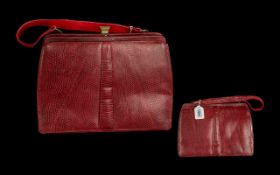 A Designer Pink Snakeskin Handbag, in good condition, with enclosed label Mappin & Webb Ltd.