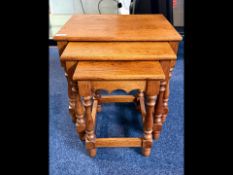 Oak Nest of Three Tables, turned supports. Height 18'', top measures 20 x 15.5''.