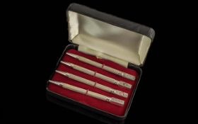 A Fine Sterling Silver Cased Set of Four Bridge Propelling Pencils with the Playing Card Logos.