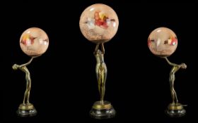 Art Deco Table Lamp, spelter, in the form of an elegant dancer holding globular shade with mottled