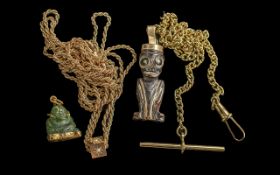 Small Jade Carving of Buddha, mounted in gold coloured metal pendant, with another similar carved