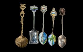 Ten Souvenir Metal Spoons, some enamelled, and a pair of Rolex spoons.