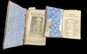Two Early German Printed Bibles, in block Gothic script, with illustrations of Saints. Bound in