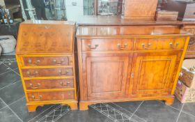 Yew Wood Bureau with fitted interior above four graduating drawers, together with a sideboard with