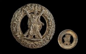 A Rate Scottish Medallion Boss Roundell depicting a crucified man, St Andrew, a regimental Plaid