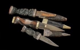 Three Small Scottish Antique Daggers in scabbards, two with silver mounts and gemstone mounts.