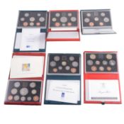 Six UK Proof and Deluxe Proof Coin Sets.