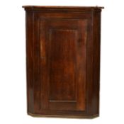 George III oak and elm hanging corner cupboard,