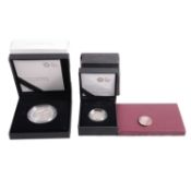 Three silver coins.