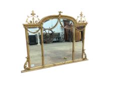 An Edwardian Adam revival giltwood and composition triple plate overmantel mirror, width 116cm,