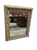 A Victorian giltwood and composition rectangular picture frame, now as a wall mirror, width 81cm,