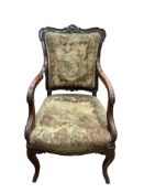 A mid 19th century carved mahogany elbow chair with polychrome tapestry upholstery, width 56cm,