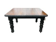 A late Victorian carved oak extending dining table, width 176cm extended, one spare leaf, depth