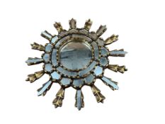 A small Peruvian circular sunburst wall mirror, diameter 34cm