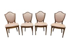 A set of four George III satinwood cane seat dining chairs with shield shape backs, width 50cm,