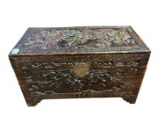 A mid 20th century Chinese carved camphorwood trunk, width 87cm, depth 43cm, height 49cm
