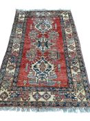 A modern Caucasian style brick red ground rug, 190 x 120cm