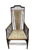 An Art Nouveau mahogany high back armchair in the manner of Charles Rennie Macintosh, width 57cm,