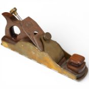An unmarked dovetailed adjustable jack plane with gunmetal sides and steel sole, rosewood handle and