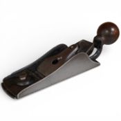 An unmarked Stanley block plane with removable rear handle and adjustable throat, fitted with a