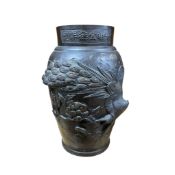 A Japanese bronze vase decorated with a dragon and birds of prey, height 25cm.