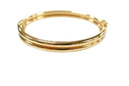 An Italian Uno-A-Erre 9ct gold double band hinged bangle, interior diameter approximately 60mm, 10.3
