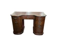 A walnut Queen Anne Revival kneehole pedestal desk, width 124cm, depth 57cm, height 77cm