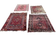 Three Shiraz rugs and another, largest 170 x 120cm