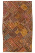 A 20th century Indian Rajasthani mirrored, silk and wool embroidered wall hanging. Intricately
