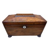 A William IV mahogany sarcophagus shaped tea caddy, with mother of pearl lock escutcheon and glass