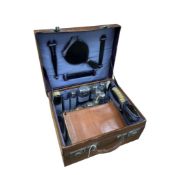 A silver-mounted toilet set, in fitted leather case, four other silver-mounted bottles and a smaller