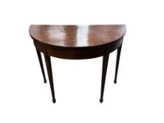 A George III mahogany demi-lune folding card table, width 92cm, depth 45cm, height 73cm