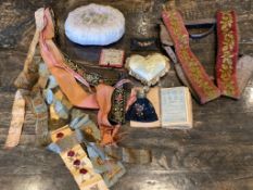 Various 19th century ribbons, needle case, heart pin cushion, purse, embroidery book, wool work