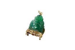 A green chalcedony pendant, composed of a green chalcedony Buddha on a 9ct gold throne, length 3.