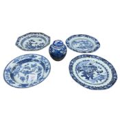 Four 18th century Chinese export blue and white porcelain dishes (three rivetted), largest 23cm